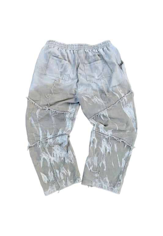 Light gray camouflage shorts on a concrete surface